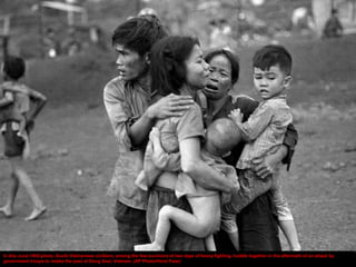 In this June 1965 photo, South Vietnamese civilians, among the few survivors of two days of heavy fighting, huddle together in the aftermath of an attack by
government troops to retake the post at Dong Xoai, Vietnam. (AP Photo/Horst Faas)
 