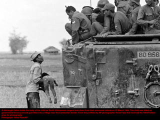 A distraught father holds the body of his child as South Vietnamese rangers look down from their armoured vehicle on 19 March 1964. The child was killed as
government forces pursued guerrillas into a village near the Cambodian border. From the portfolio by AP photographer Horst Faas that received the 1965 Pulitzer
prize for photography
Photograph: Horst Faas/AP
 