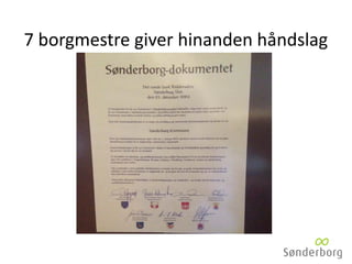7 borgmestre giver hinanden håndslag
 