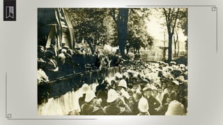 School children under the direction of Professor James Johnson sing O Canada at the unveiling
 