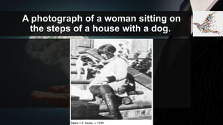 A photograph of a woman sitting on
the steps of a house with a dog.
 