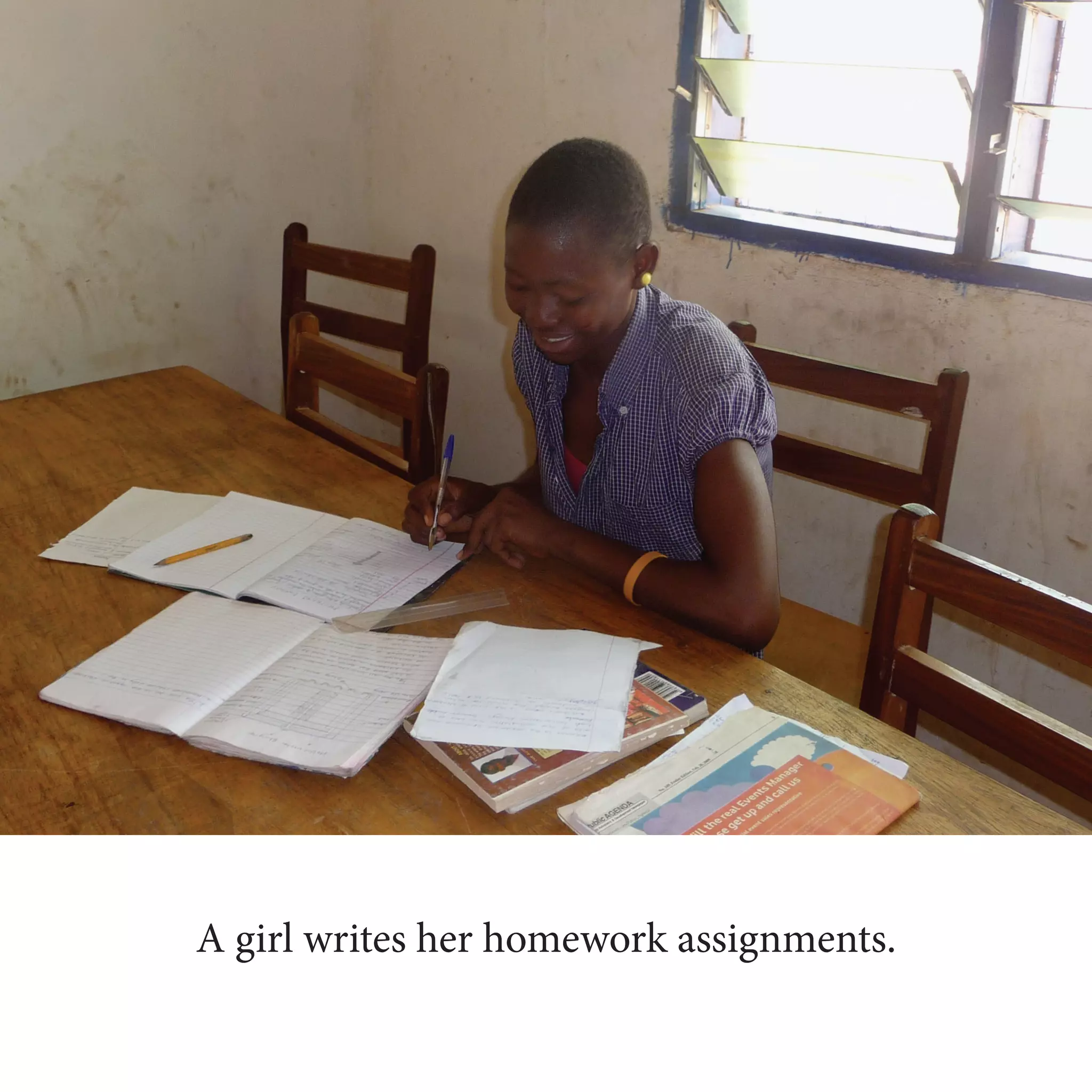 A girl writes her homework assignments.