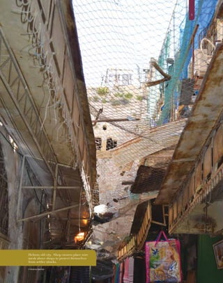 55
© Vivienne Gorman
Hebron old city. Shop owners place wire
mesh above shops to protect themselves
from settler attacks.
 