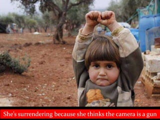 She’s surrendering because she thinks the camera is a gun
 