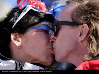 A Russian couple kisses during the men’s super-combined at the alpine ski venue

 