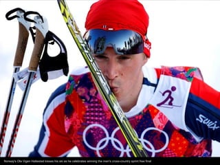 Norway's Ola Vigen Hattestad kisses his ski as he celebrates winning the men's cross-country sprint free final

 