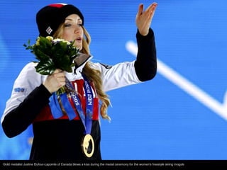 Gold medalist Justine Dufour-Lapointe of Canada blows a kiss during the medal ceremony for the women's freestyle skiing mo...