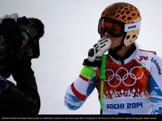 Austria's Anna Fenninger blows a kiss to a television camera in the finish area after competing in the first run of the wo...
