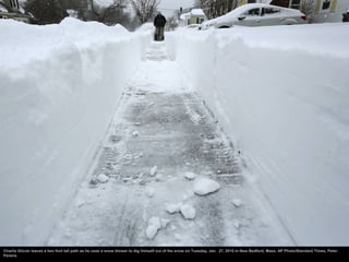 Charlie Glover leaves a two foot tall path as he uses a snow blower to dig himself out of the snow on Tuesday, Jan. 27, 20...