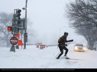 A woman cross country skis on snow covered roads during a winter blizzard in Boston, Massachusetts January 27, 2015. Reute...