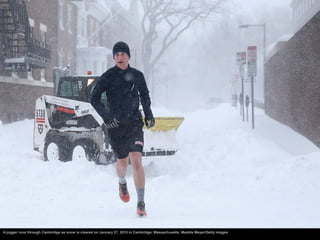 A jogger runs through Cambridge as snow is cleared on January 27, 2015 in Cambridge, Massachusetts. Maddie Meyer/Getty Ima...
