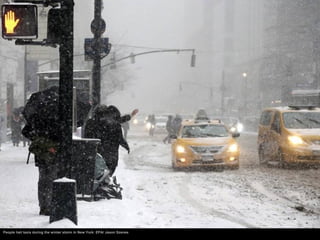 People hail taxis during the winter storm in New York. EPA/ Jason Szenes
 