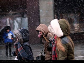 People walk during a snow storm in New York's Times Sqaure on January 26, 2015. Jewel Samad /AFP/Getty Images
 