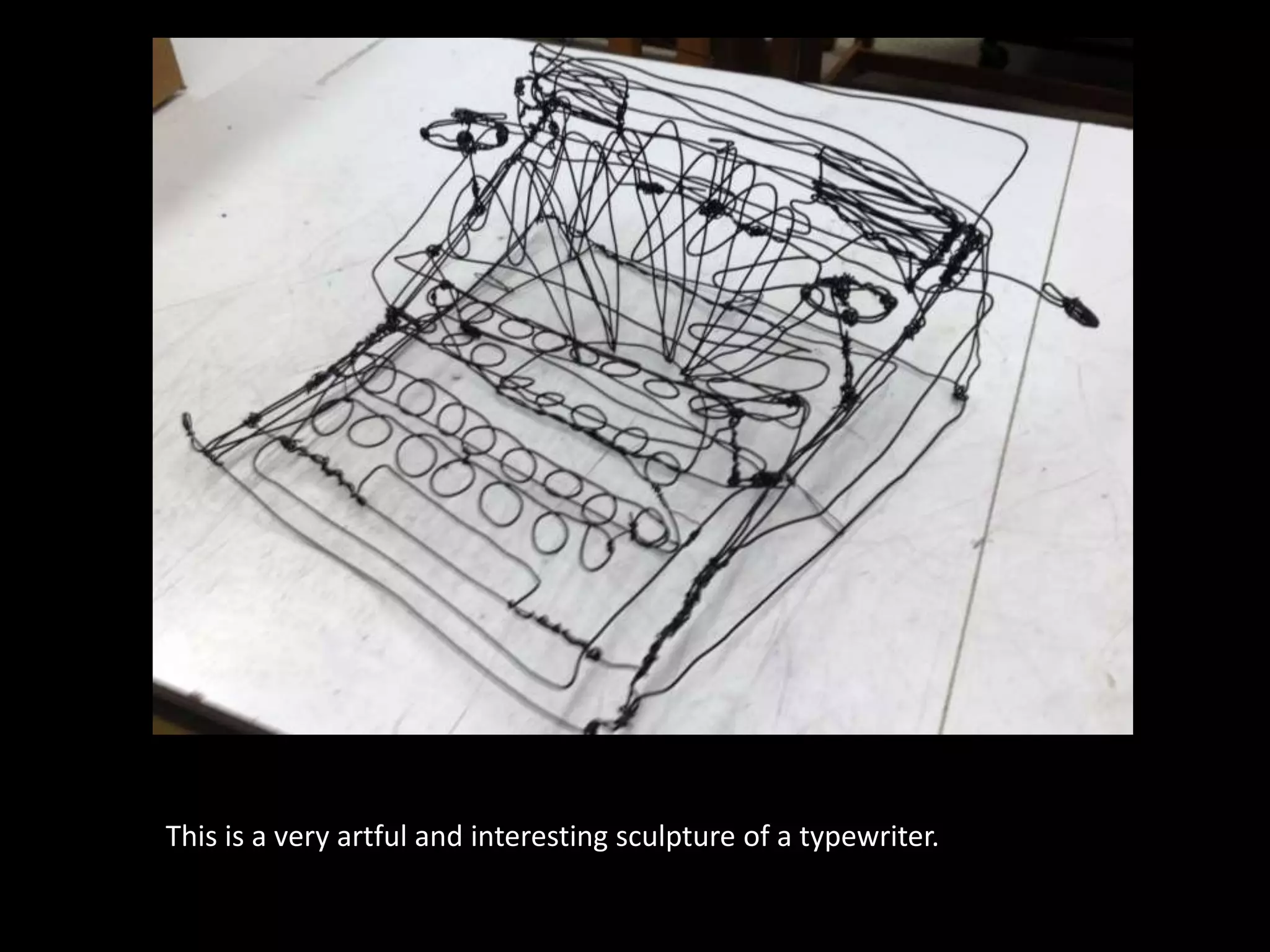 This is a very artful and interesting sculpture of a typewriter.
 