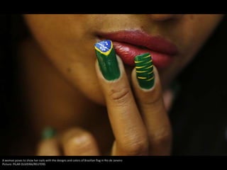 A woman poses to show her nails with the designs and colors of Brazilian flag in Rio de Janeiro
Picture: PILAR OLIVEIRA/REUTERS
 