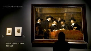 A woman looks at Rembrandt's painting
1
 