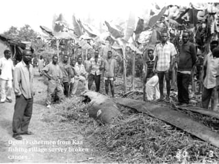 Ogoni Fishermen from Kaa
fishing village survey broken
canoes .

 
