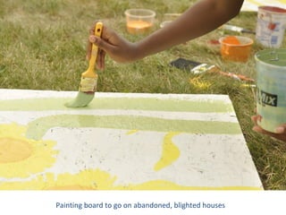 Painting board to go on abandoned, blighted houses
 