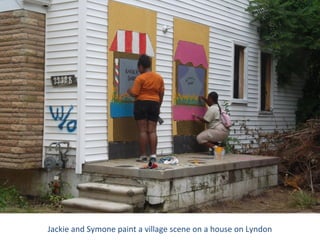 Jackie and Symone paint a village scene on a house on Lyndon
 