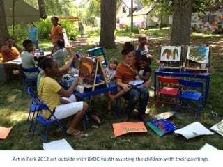 Art in Park 2012 art outside with BYDC youth assisting the children with their paintings
 