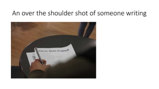 An over the shoulder shot of someone writing
 