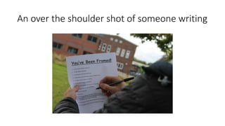 An over the shoulder shot of someone writing
 