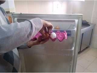 arranging / putting eggs into the fridge