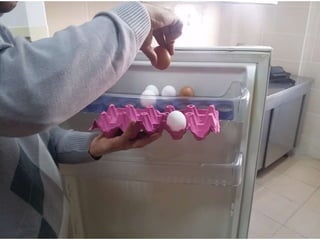 arranging / putting eggs into the fridge