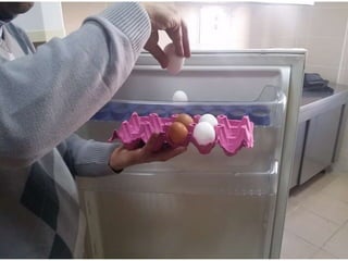 arranging / putting eggs into the fridge
