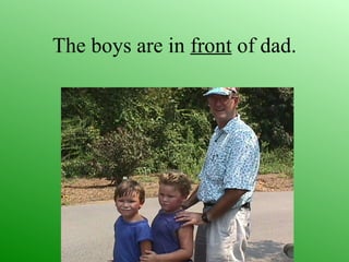 The boys are in front of dad.