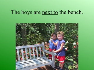 The boys are next to the bench.